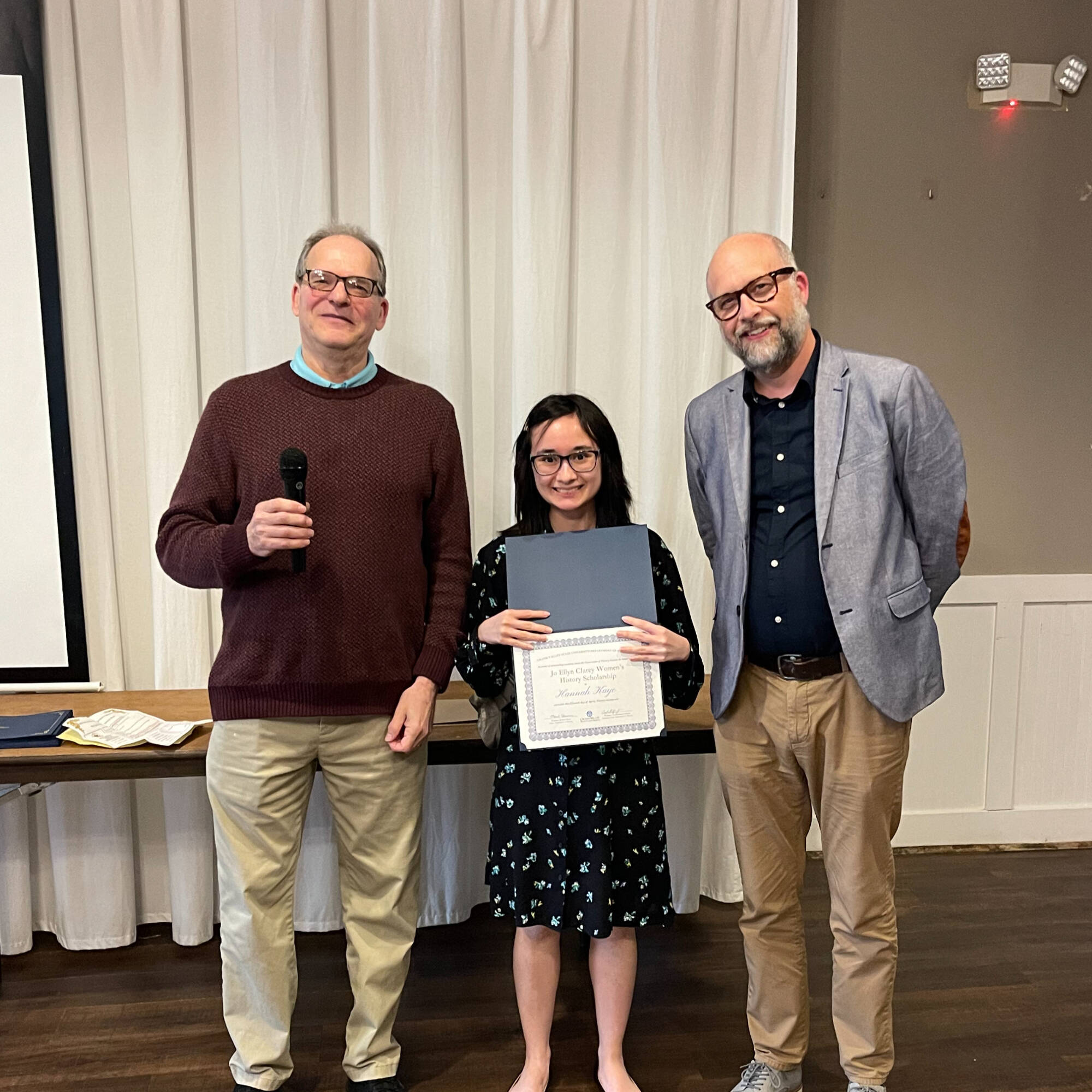 Hannah Kaye holding award with professors Montagna & Huner